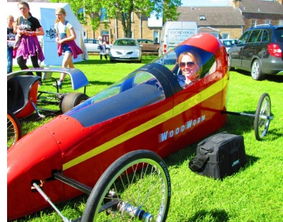 Zara Lane sitting in the Woodworm cart. Sunshine at Denholm 2013.